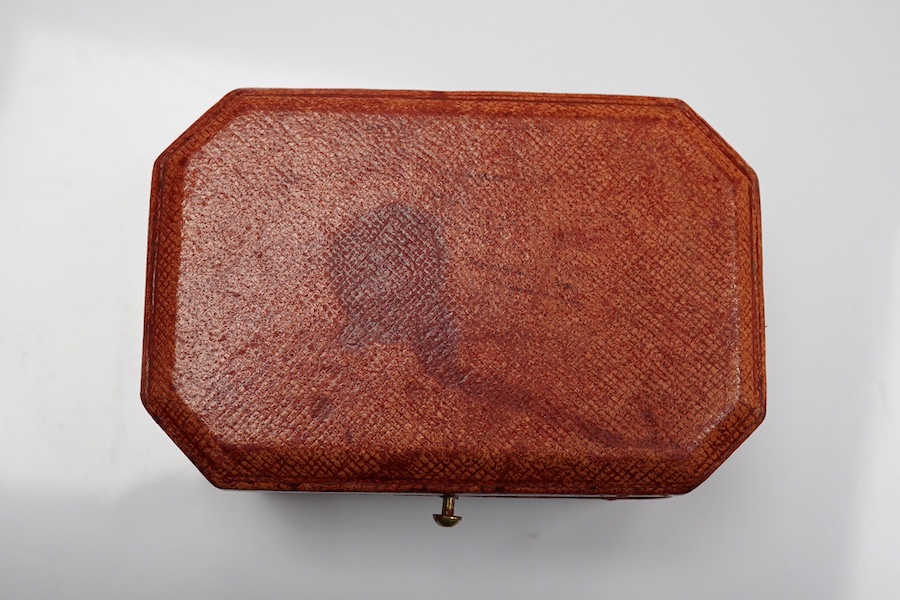 A 1930's/1940's Cartier gilt tooled leather cufflink box, of octagonal form, 83mm by 54mm. Condition - poor to fair